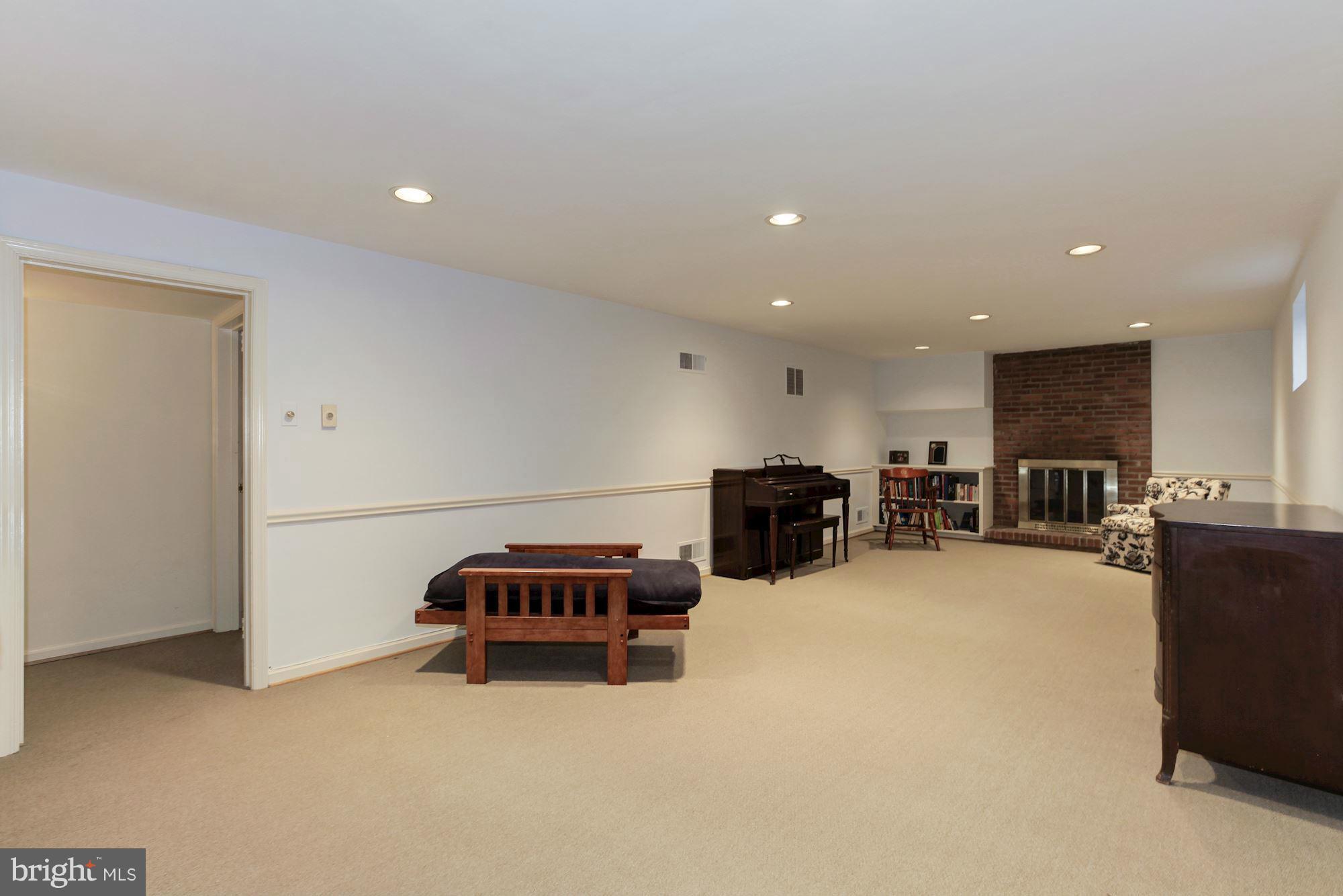 5502 Pollard Road Bethesda, MD 20816 - Photo 24 of 30 a room with furniture and a flat screen tv