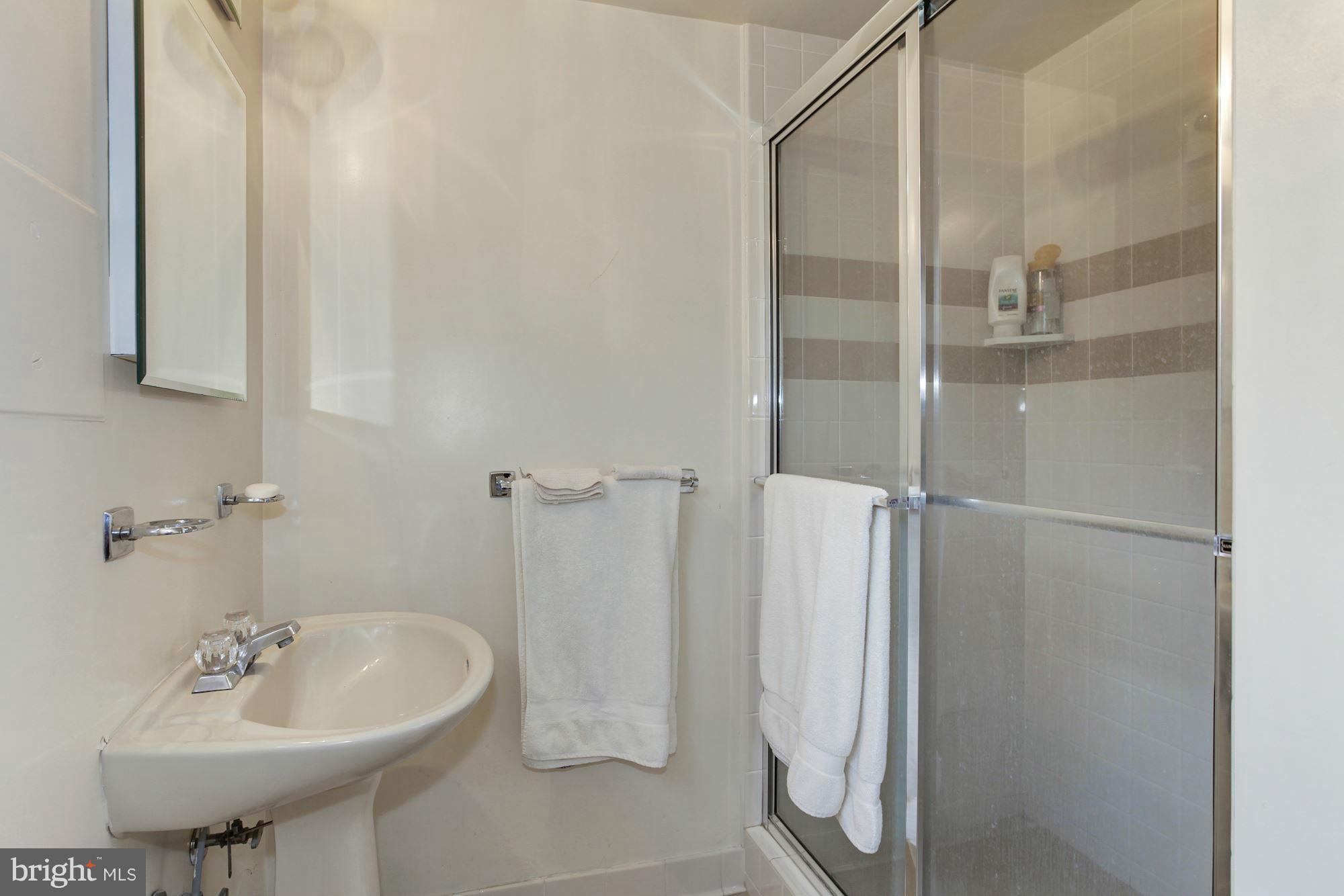 5502 Pollard Road Bethesda, MD 20816 - Photo 26 of 30 a bathroom with a sink and a mirror