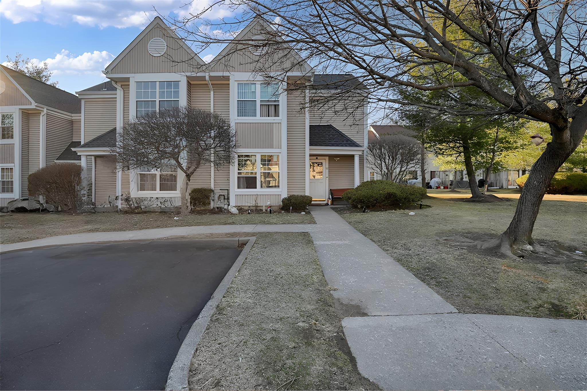 52 Creekside Circle Spring Valley, NY 10977 - Photo 1 of 1 front view of a house with a yard