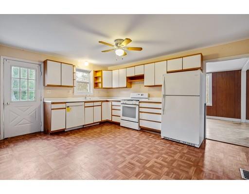 35 Alpine Road Wayland, MA 01778 - Photo 23 of 42 a kitchen with white cabinets and white appliances