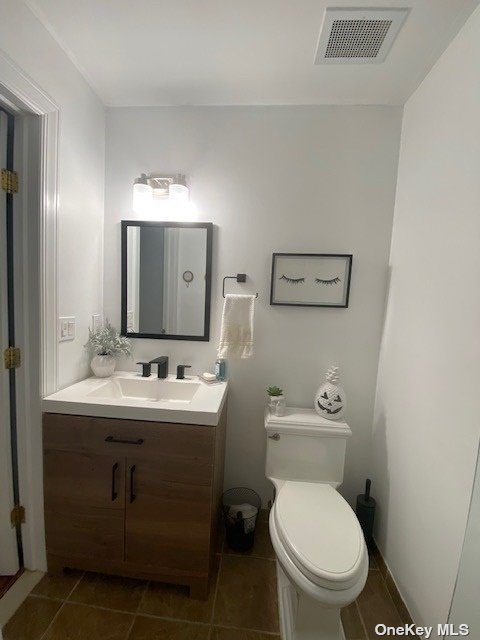 272 Medea Way, Unit 272 Central Islip, NY 11722 - Photo 1 of 1 a bathroom with a toilet sink and mirror
