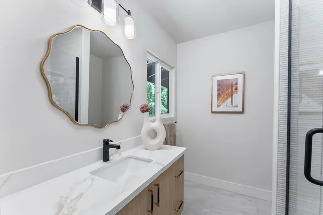 a bedroom with a large bed and a large window