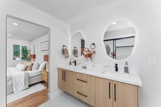 a view of a patio with table and chairs with wooden floor and fence