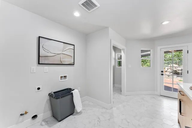 a view of backyard with outdoor seating and green space