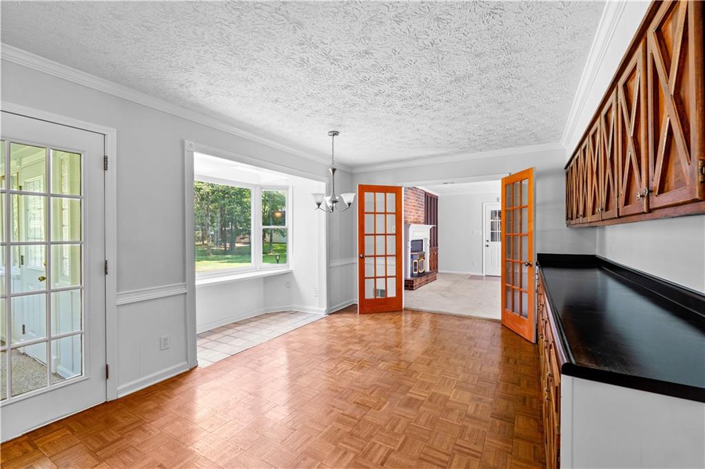 894 Upper Woolsey Road Hampton, GA 30228 - Photo 25 of 96 a view of an empty room with a window and wooden floor