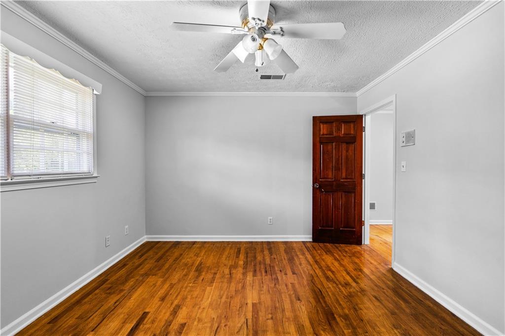 894 Upper Woolsey Road Hampton, GA 30228 - Photo 46 of 96 wooden floor in an empty room with a window
