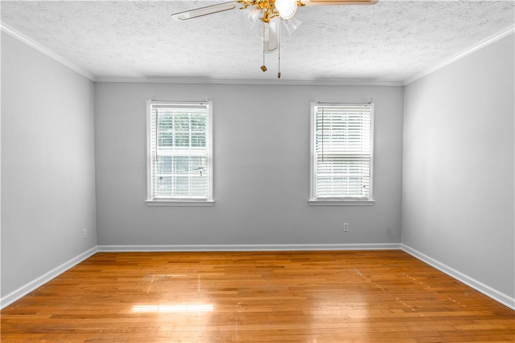 894 Upper Woolsey Road Hampton, GA 30228 - Photo 54 of 96 a view of empty room with wooden floor and fan