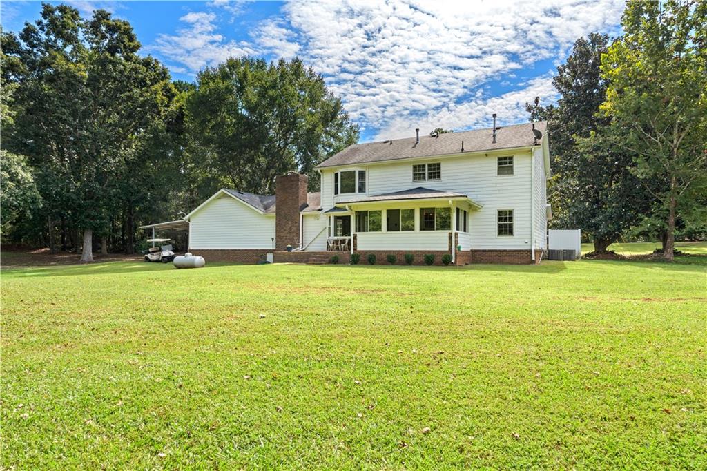 894 Upper Woolsey Road Hampton, GA 30228 - Photo 66 of 96 a front view of a house with yard and green space