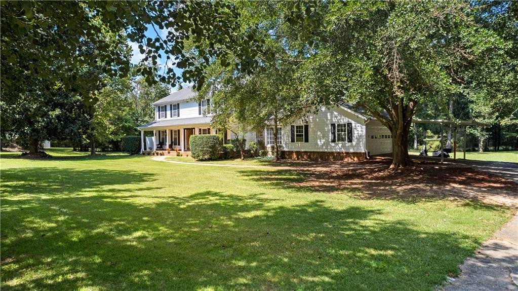 894 Upper Woolsey Road Hampton, GA 30228 - Photo 82 of 96 a front view of a house with a yard