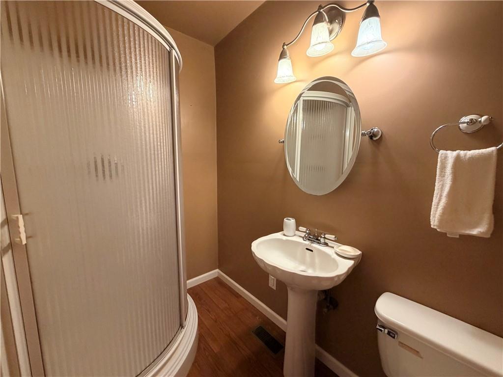 894 Upper Woolsey Road Hampton, GA 30228 - Photo 96 of 96 a bathroom with a sink mirror and toilet