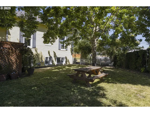 a view of a park with large trees