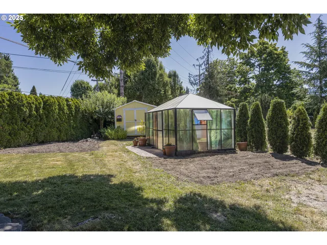 a view of a house with a yard and sitting area