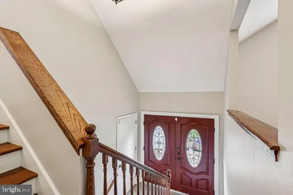 a kitchen with stainless steel appliances granite countertop a stove refrigerator and a sink
