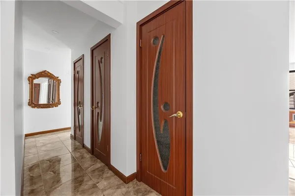 a view of a hallway with closet area