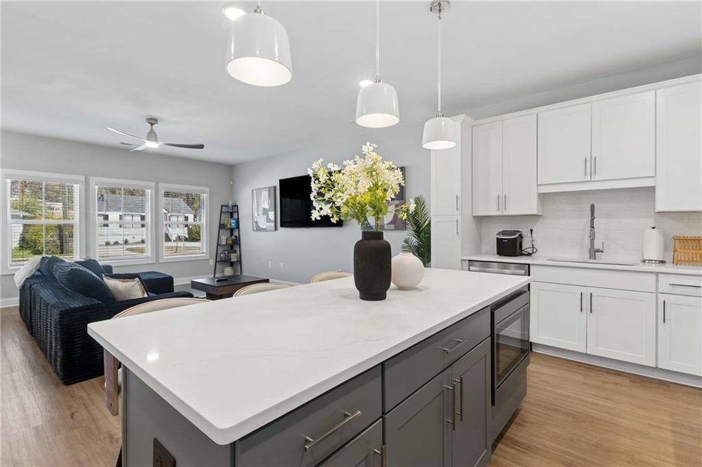 1324 Parc Bench Road Atlanta, GA 30316 - Photo 11 of 35 a kitchen with cabinets table and chairs