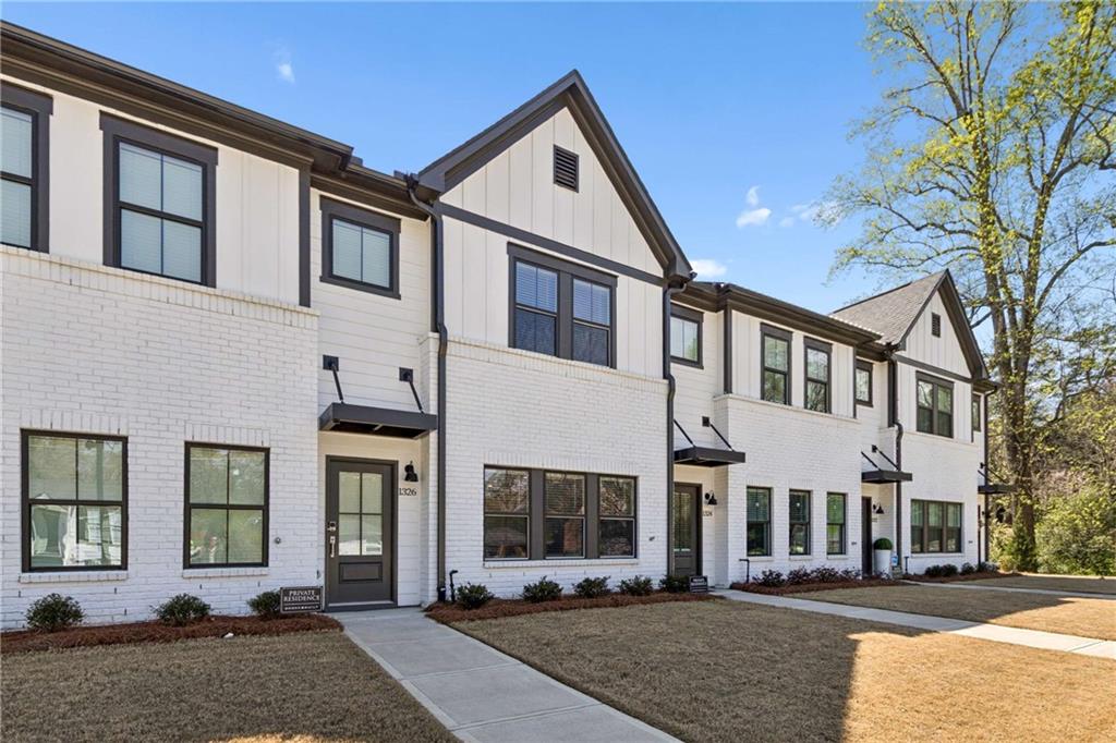 1324 Parc Bench Road Atlanta, GA 30316 - Photo 2 of 35 a front view of a house with a yard