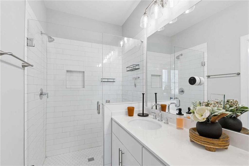1324 Parc Bench Road Atlanta, GA 30316 - Photo 29 of 35 a bathroom with a sink a tub and shower