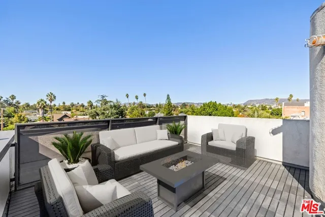 a view of a terrace with couches and a table