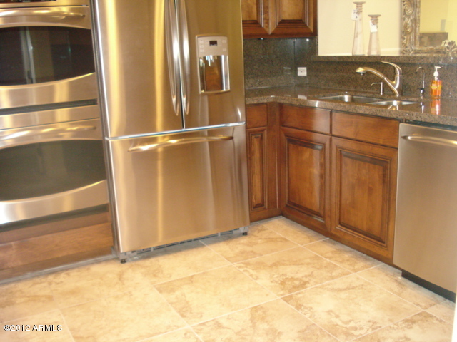 7760 East Gainey Ranch Road, Unit 10 Scottsdale, AZ 85258 - Photo 6 of 17 Tile Floors Downstairs