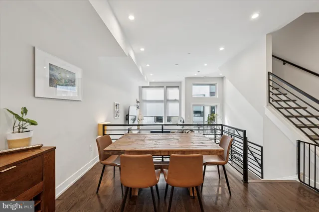 an open kitchen with a table and chairs