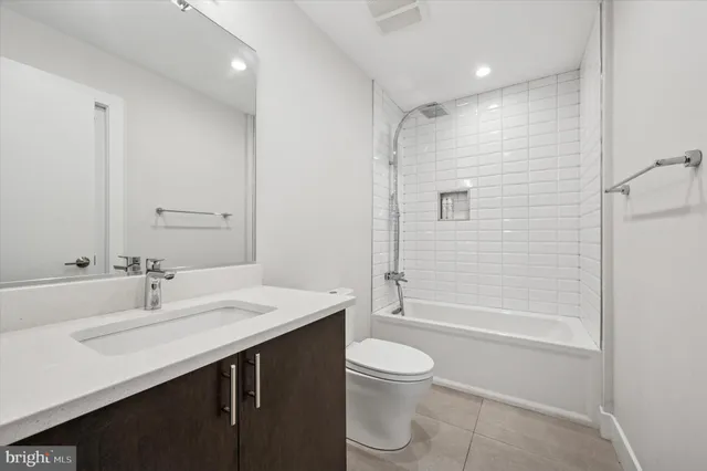 a bedroom with furniture and wooden floor