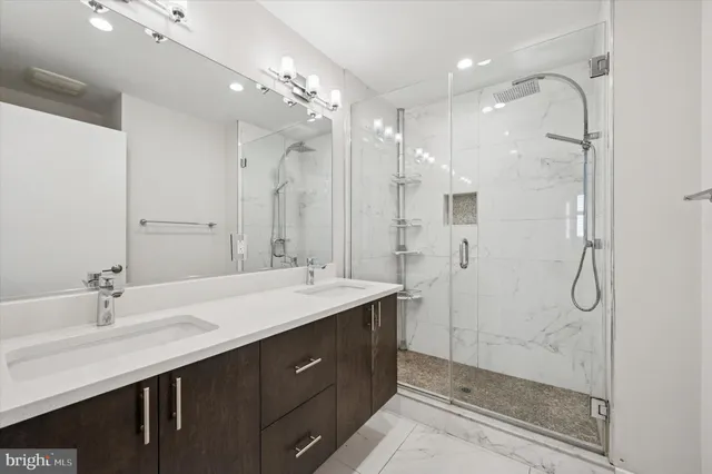 a living room with furniture a window and a flat screen tv