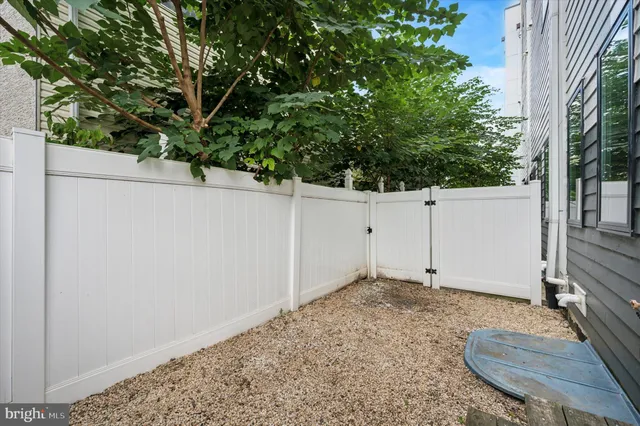 a front view of a house with a sink and table and chairs