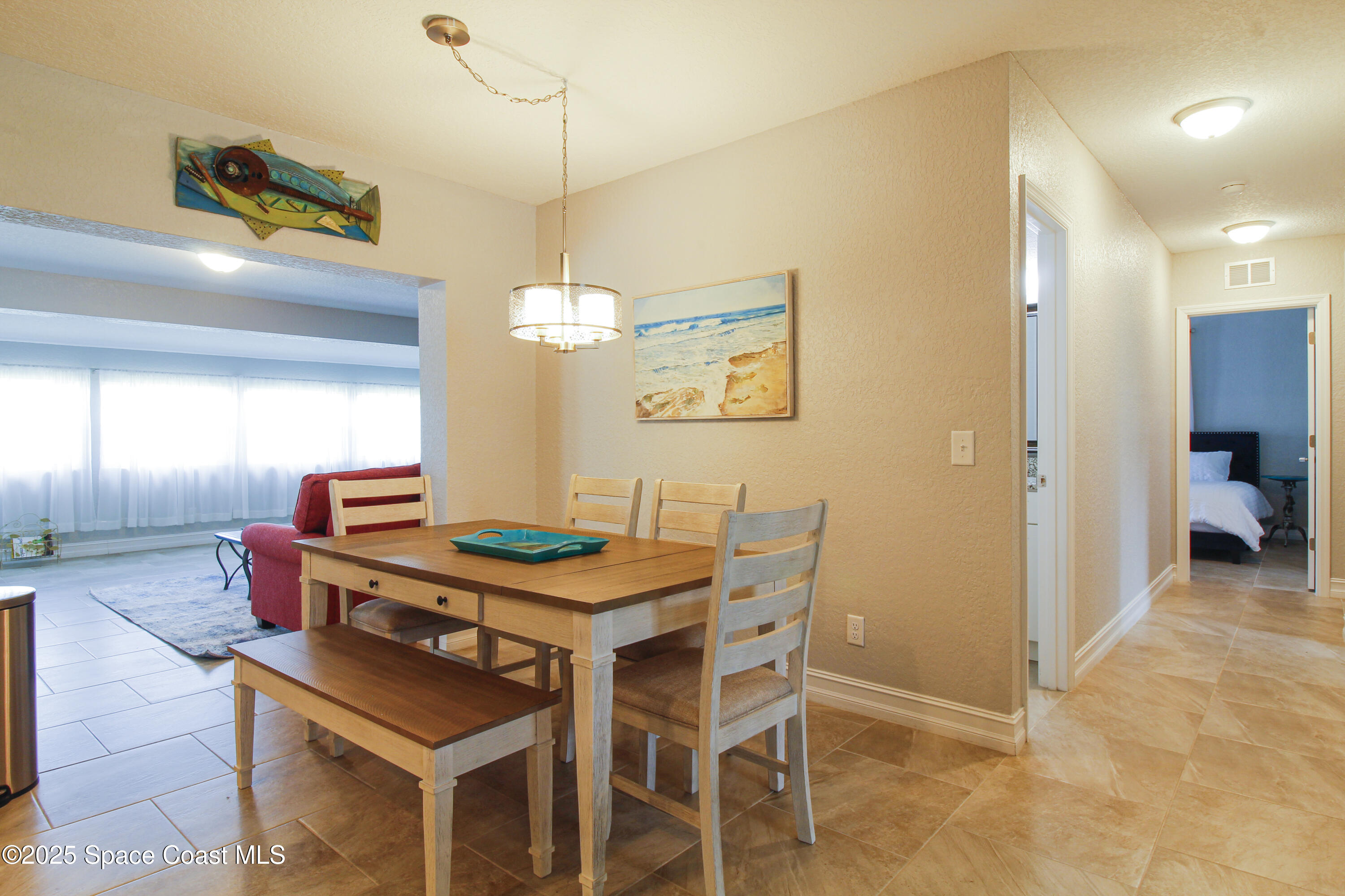 827 Glenmore Circle Melbourne, FL 32901 - Photo 8 of 30 a dining room with a table and chairs
