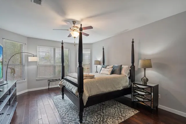 a living room with furniture a large window and a table