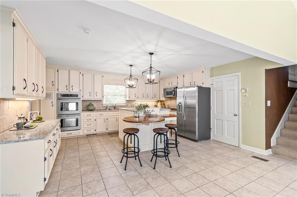 1318 Robinhood Road High Point, NC 27262 - Photo 15 of 43 Note side staircase leads to upstairs Bonus area