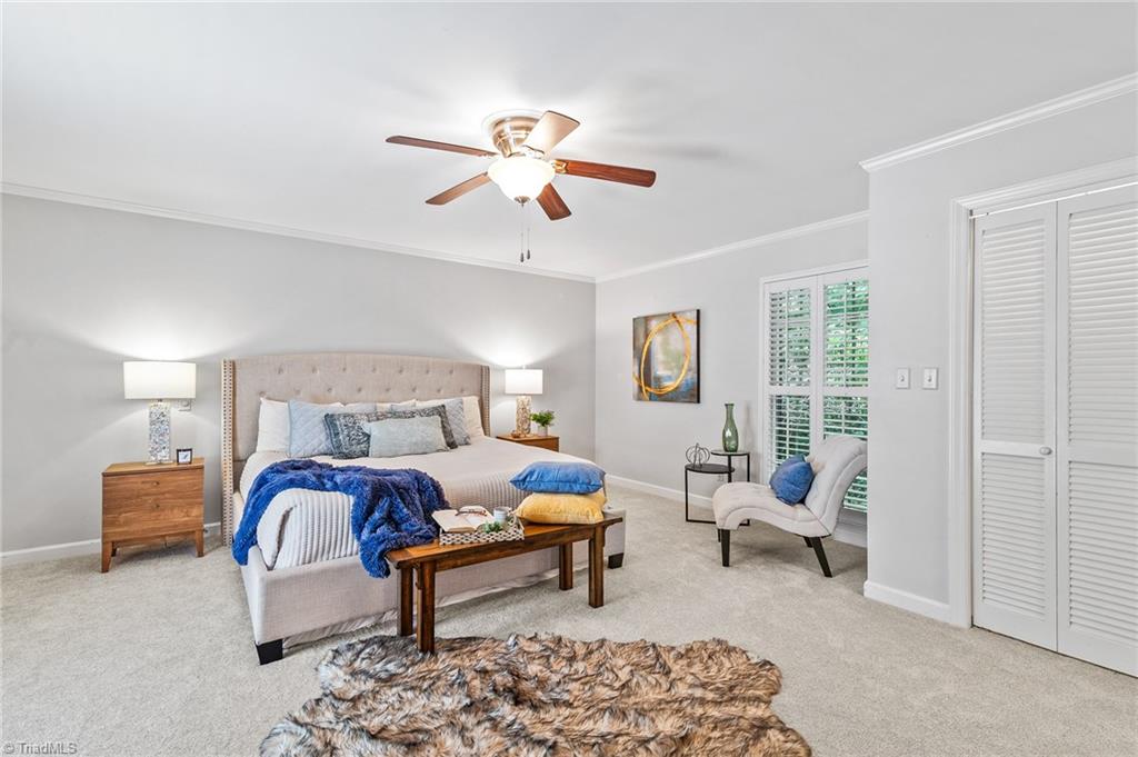 1318 Robinhood Road High Point, NC 27262 - Photo 22 of 43 Spacious and Airy, this master bedroom feels like a private retreat!