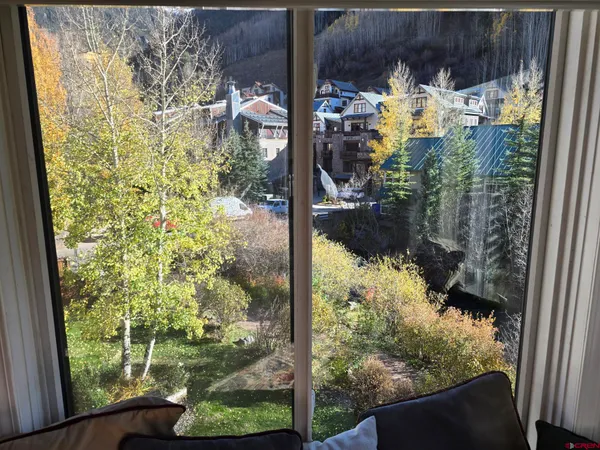 a view of a glass door and porch