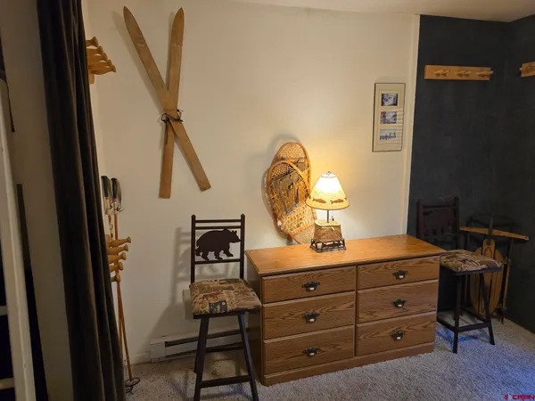 a room with a bed and furniture