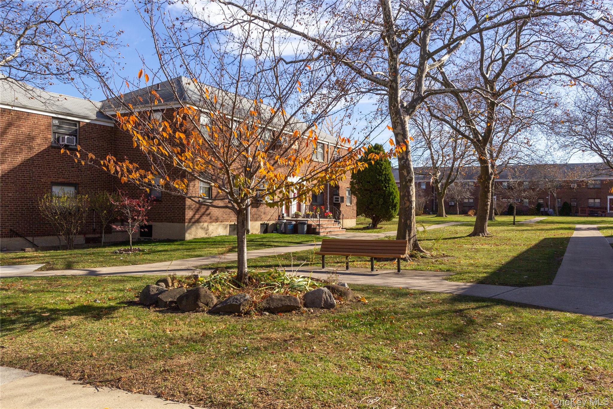 163-62 Willets Point Boulevard, Unit UPPR Queens, NY 11357 - Photo 5 of 19 a view of a park with large trees