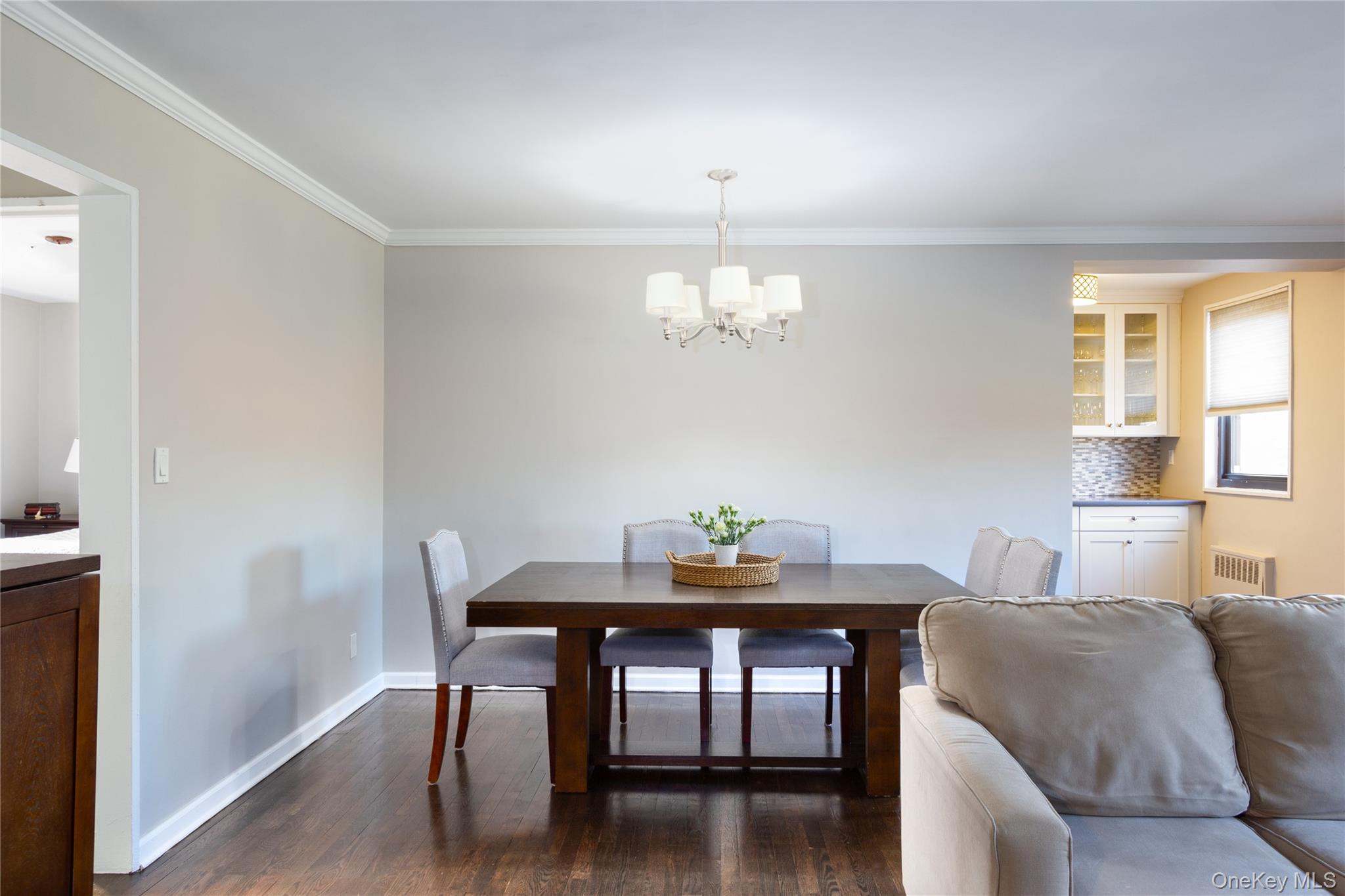 163-62 Willets Point Boulevard, Unit UPPR Queens, NY 11357 - Photo 9 of 19 a view of a dining room with furniture and wooden floor