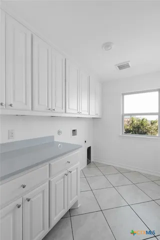 a kitchen with white cabinets