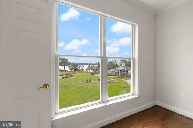 an aerial view of a house with a lake view