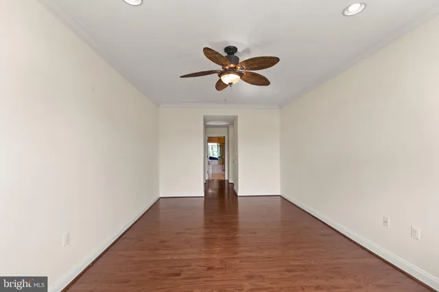 a view of a park with bench and trees