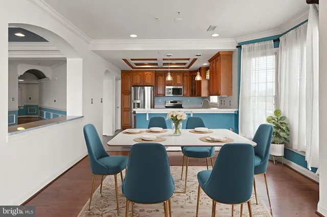 a living room with a fireplace and wooden floor