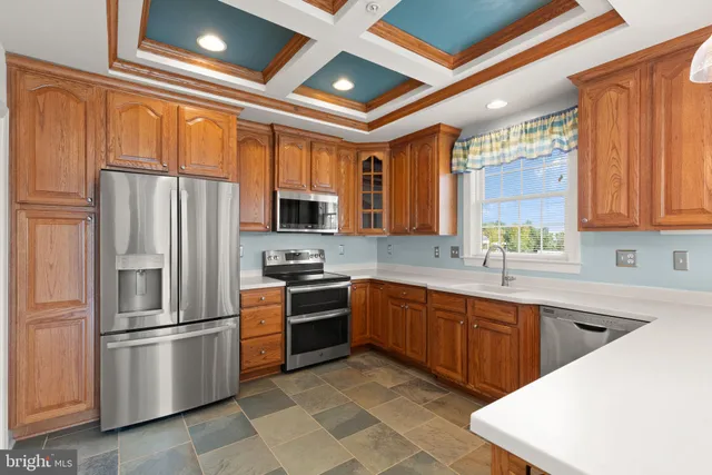 a view of a hallway with entryway wooden floor and front door
