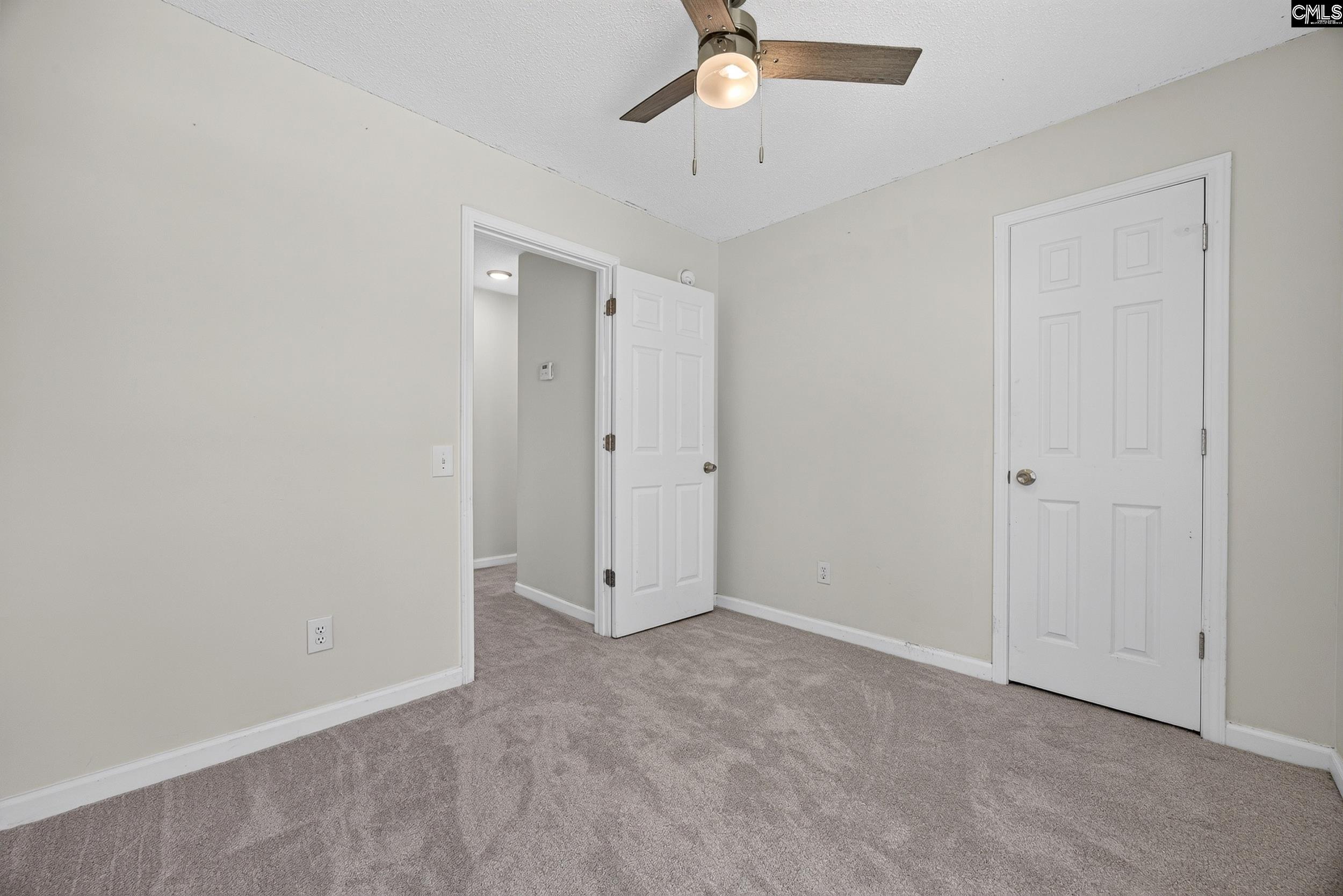 407 Sesqui Trail Columbia, SC 29223 - Photo 28 of 34 an empty room with chandelier fan