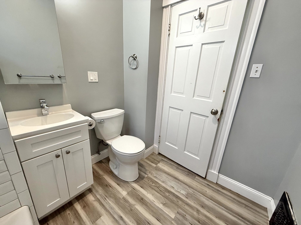 23 Park Road, Unit 23 Belmont, MA 02478 - Photo 13 of 21 a bathroom with a sink a toilet and a mirror