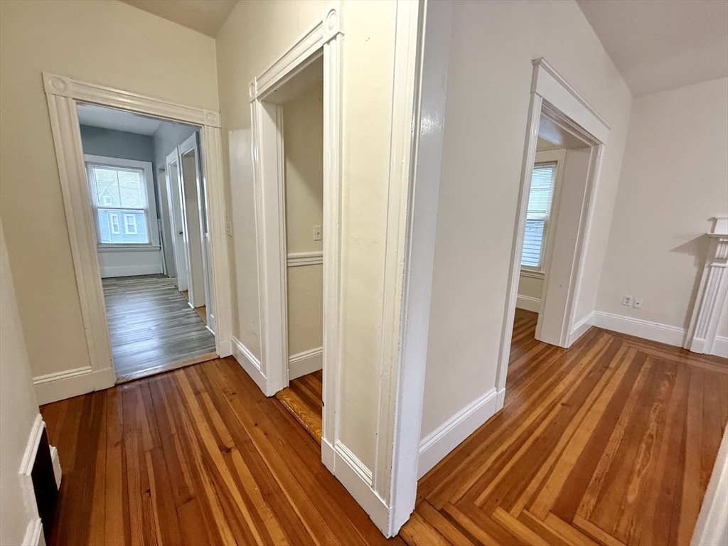 23 Park Road, Unit 23 Belmont, MA 02478 - Photo 14 of 21 a view of a hallway with wooden floor and staircase
