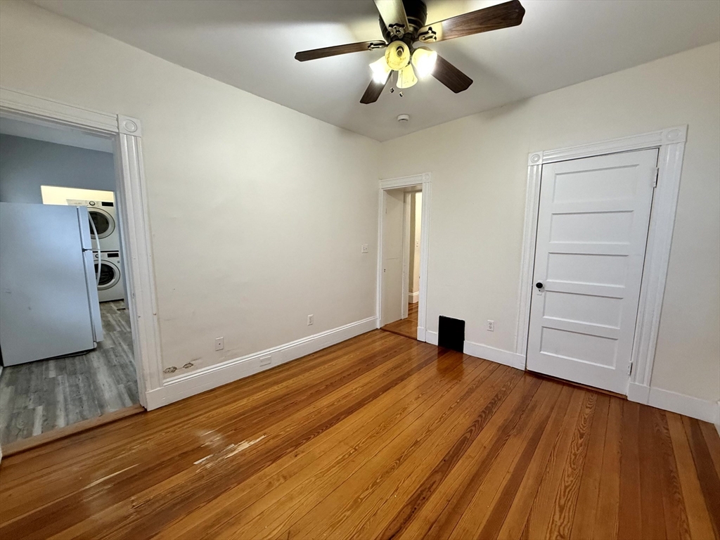 23 Park Road, Unit 23 Belmont, MA 02478 - Photo 15 of 21 wooden floor in an empty room with a window