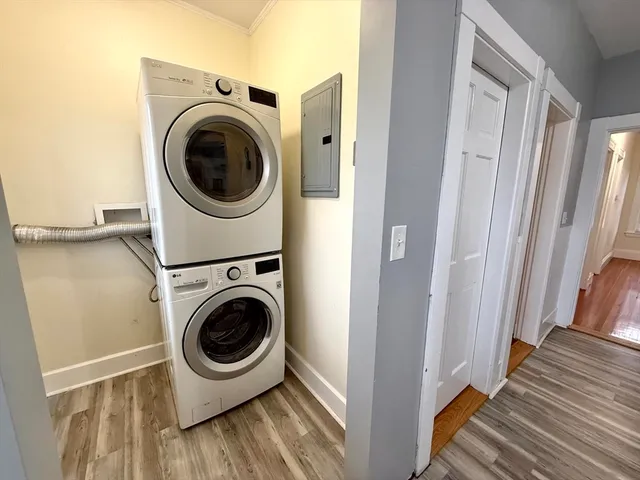 a view of a hallway with washer and dryer