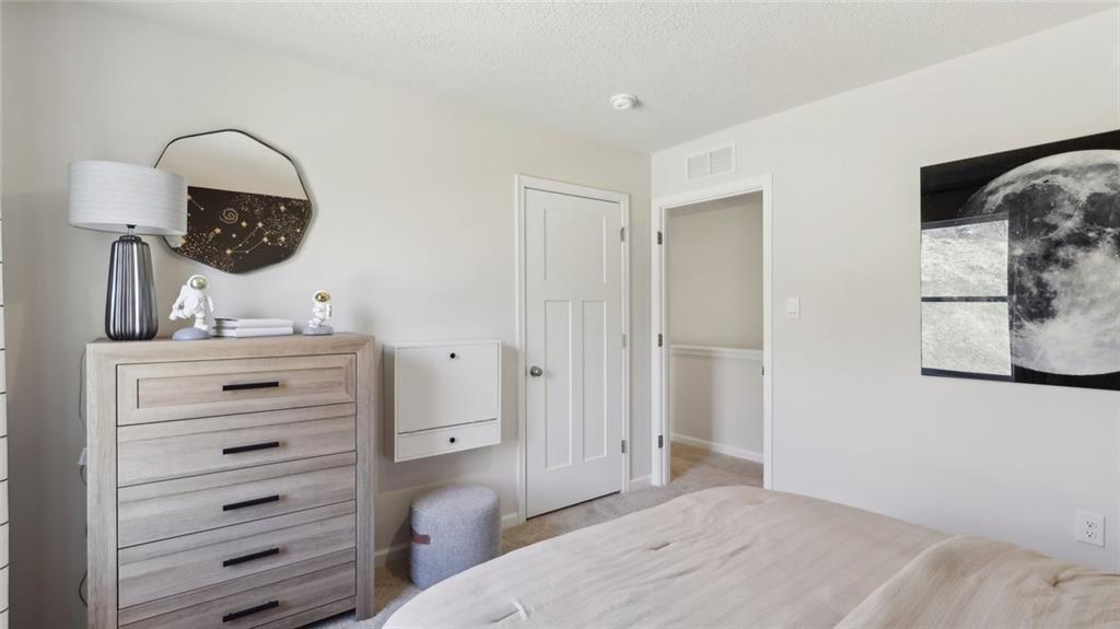 1091 Peachtree Road Carnegie, PA 15106 - Photo 11 of 18 a bedroom with a bed and a mirror