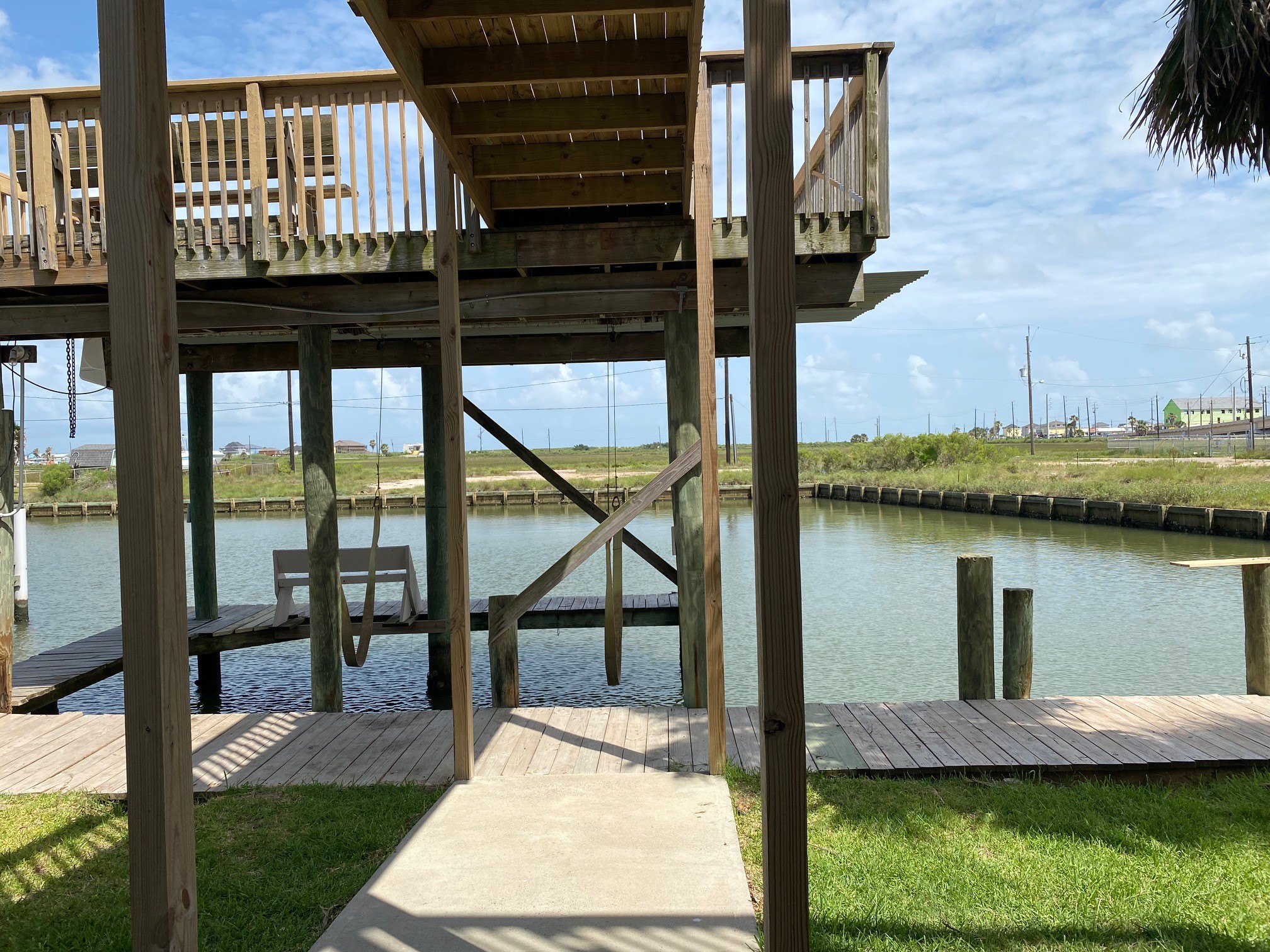 106 Pompano Lane Surfside Beach, TX 77541 - Photo 34 of 39 Pier to Sundeck over Boat Slip with Boat Lift
