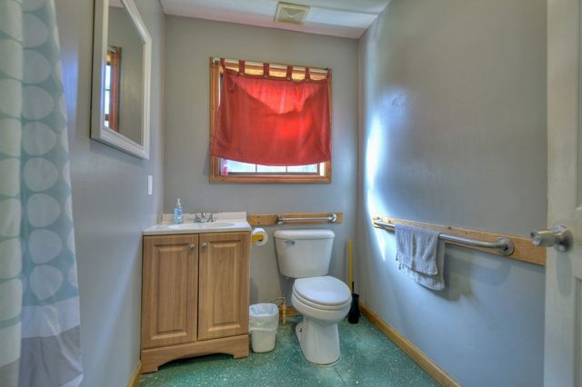a bathroom with a shower and toilet