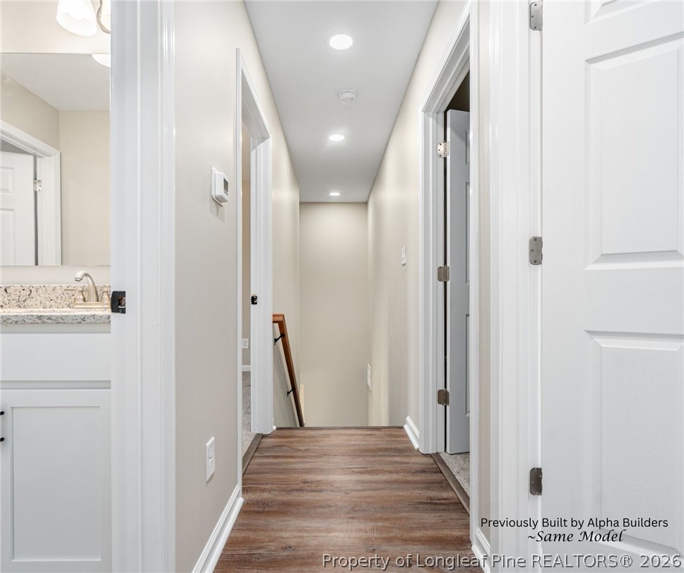 973 Martin Road St. Pauls, NC 28384 - Photo 14 of 19 Upstairs hallway connecting bedrooms and full guest bathroom.