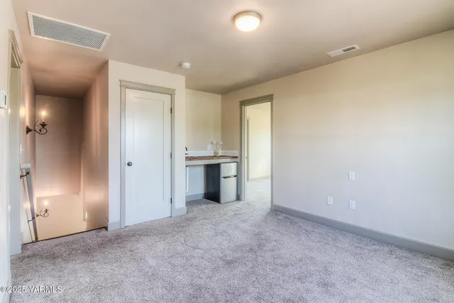 a view of a kitchen with a sink